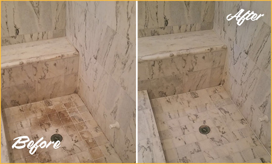 Before and After Picture of a Dirty Fort George Marble Shower Cleaned to Eliminate Dark Stains