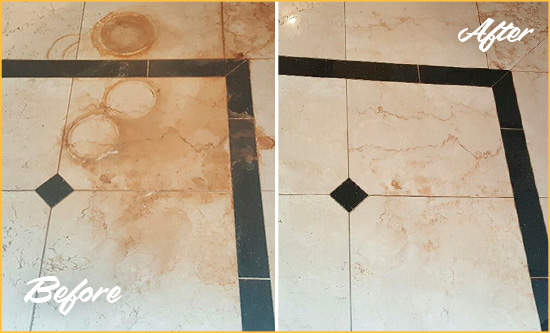 Before and After Picture of a Theater District Hard Surface Restoration Service on a Marble Floor to Eliminate Rust Stains